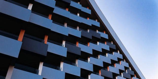Side of building with blocks stacked diagonally.